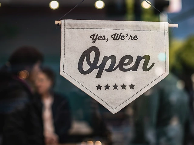 An open sign hanging in a small-business shop window