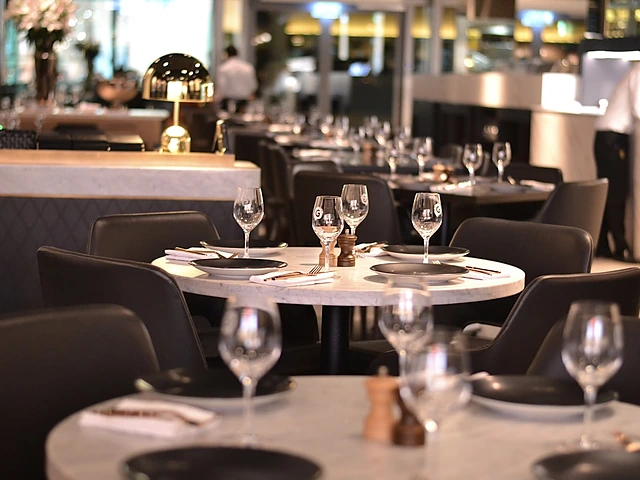 Set tables inside an upscale restaurant