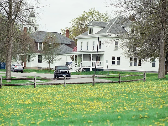 White houses along a quiet suburban street